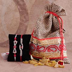Two AD Rakhi Set with Resins in Potli - Rakhi Gifts Online